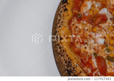 Pizza with salami and prosciutto. Meat pizza with cheese Pizza with salami and prosciutto. Meat pizza with cheese 117457481