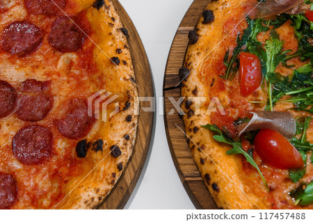 Pizza with salami and prosciutto. Meat pizza with cheese 117457488