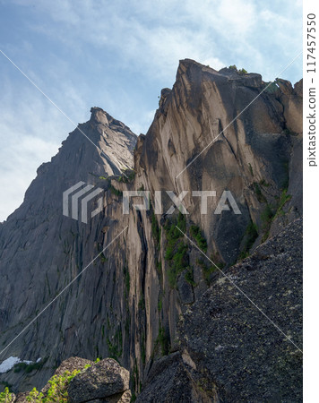 Huge sharp rocks. Pointed cliff. Vertical view. 117457550