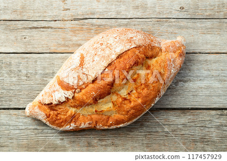 Loaf of  wheat hearth bread . Top view 117457929