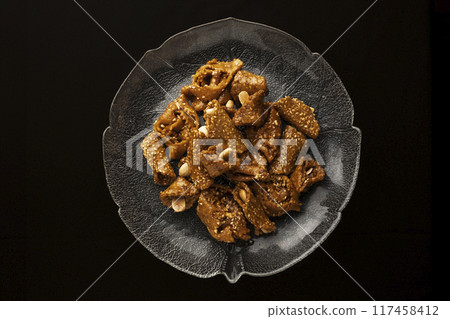 View of a plate of shebaquia, typical sweet of the month of Ramadan in Morocco View of a plate of shebaquia, typical sweet of the month of Ramadan in Morocco 117458412