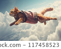 A flying orange cat in a harness soaring above the fluffy white clouds at sunrise 117458523