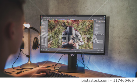 Young designer creates 3D model of game character using PC 117460469