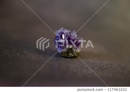 Violet amethyst quartz crystal on black background Violet amethyst quartz crystal on black background 117461032