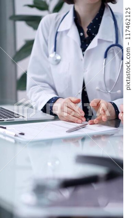 Doctor and patient are sitting and talking at the glass table, Medicine and health care concept 117462125