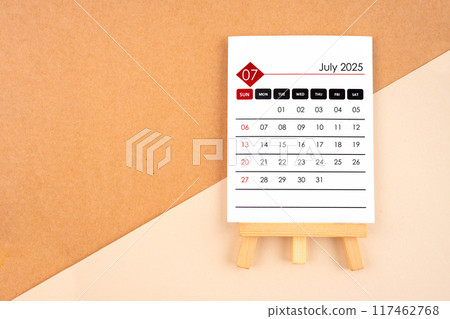 2025 July calendar page on brown background. 2025 July calendar page on brown background. 117462768