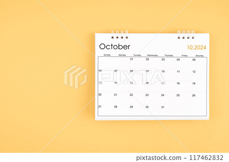 October 2024 desk calendar on yellow color background, position with copy space. 117462832