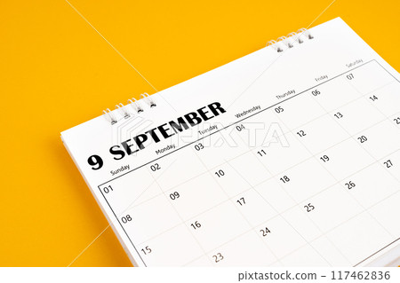 September 2024 desk calendar on yellow color background. September 2024 desk calendar on yellow color background. 117462836