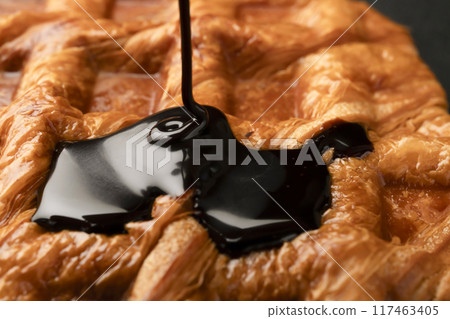 Freshly baked croffles with chocolate sauce Freshly baked croffles with chocolate sauce 117463405