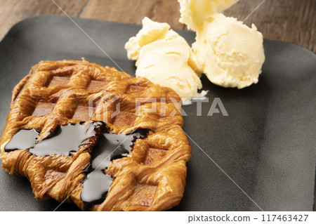 Freshly baked croffles served with ice cream Freshly baked croffles served with ice cream 117463427