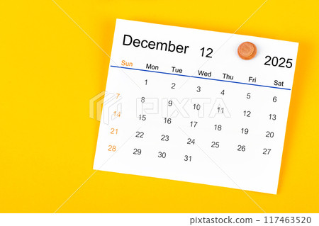 December 2025 and wooden push pin on yellow. 117463520