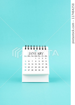 January 2025 white desk calendar on blue background. January 2025 white desk calendar on blue background. 117464258