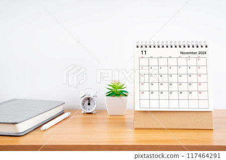November 2024, Monthly desk calendar for 2024 year on wooden table. November 2024, Monthly desk calendar for 2024 year on wooden table. 117464291