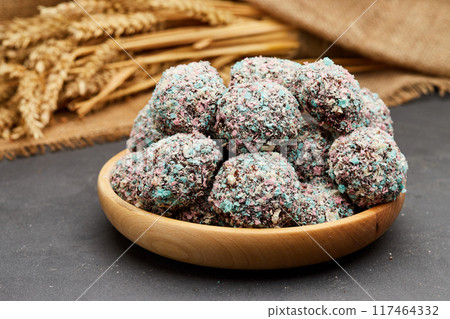 Colorful chocolate truffles with a crunchy coating, perfect for a festive and indulgent treat Colorful chocolate truffles with a crunchy coating, perfect for a festive and indulgent treat 117464332
