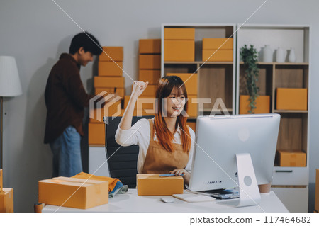 Small business owners couple entrepreneurs working with parcel, e-business, marketing, online shop, sme, entrepreneurs 117464682