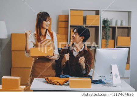 Small business owners couple entrepreneurs working with parcel, e-business, marketing, online shop, sme, entrepreneurs Small business owners couple entrepreneurs working with parcel, e-business, marketing, online shop, sme, entrepreneurs 117464686