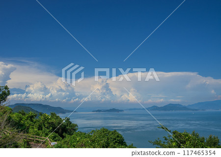 The blue Seto Inland Sea and summer white clouds as seen from Megijima Washigamine Observatory 117465354