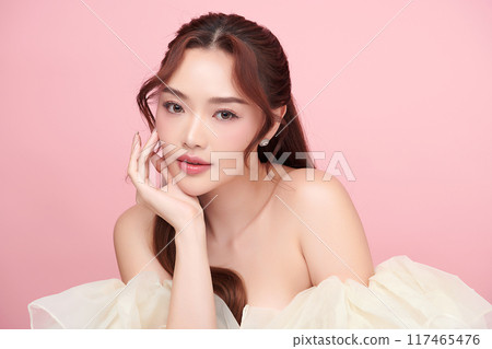 Beautiful young asian woman with clean fresh skin on pink background, Face care, Facial treatment, Cosmetology, beauty and spa, Asian women portrait. 117465476