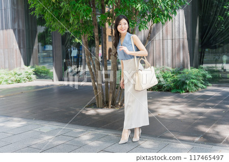businesswoman walking in office businesswoman walking in office 117465497