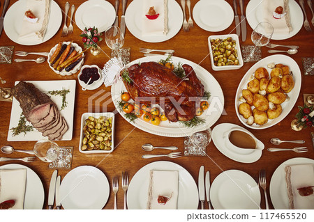 Above, table and dinner with food or turkey chicken in home for family reunion, gathering and celebration. Brunch, buffet and feast in desk for thanksgiving or Christmas with support, love and care 117465520