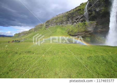 Seljalandsfoss waterfall and rainbow in Iceland in summer Seljalandsfoss waterfall and rainbow in Iceland in summer 117465577