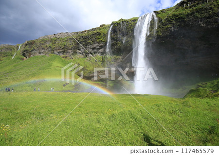 Seljalandsfoss waterfall and rainbow in Iceland in summer Seljalandsfoss waterfall and rainbow in Iceland in summer 117465579