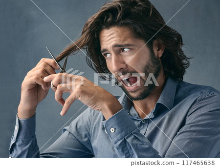Trimming, hair and scared man with scissors for grooming, facial cleaning and mistake on grey studio background. Barber, fail and face of fear model cutting hair for comedy cosmetic beauty look 117465638