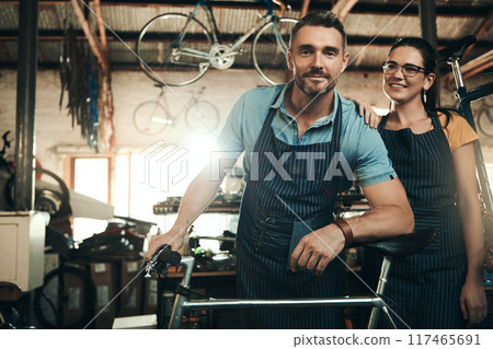 Man, woman and bicycle shop with smile for maintenance job, startup with transport service. Bike, mechanic and entrepreneur couple in workshop, happiness for sustainable business with travel 117465691