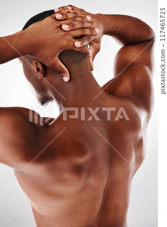 Black man, back and flex for muscle in studio, strong arms and progress development on white background. Male person, confident and athlete for power or healthy body, bodybuilder and tough or fitness Black man, back and flex for muscle in studio, strong arms and progress development on white background. Male person, confident and athlete for power or healthy body, bodybuilder and tough or fitness 117465725