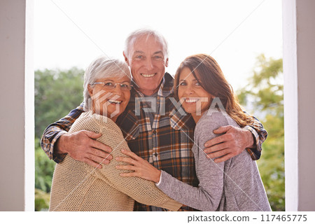 Portrait, seniors and hug daughter, outdoor and home for summer for happiness, smile and joy. Family, women and man embrace on patio for visit of girl to house of parents in retirement, love and care Portrait, seniors and hug daughter, outdoor and home for summer for happiness, smile and joy. Family, women and man embrace on patio for visit of girl to house of parents in retirement, love and care 117465775