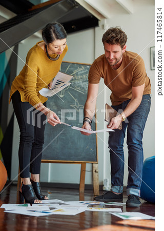 Designers, people and creative with documents on floor, logo planning and brand brainstorming for company project. Employee, collaboration and idea for startup together, teamwork and thinking 117465814