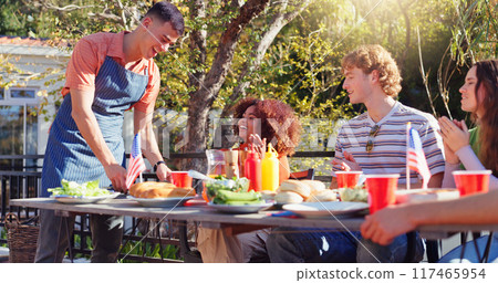 Friends, group and happy for bbq outdoor on terrace with conversation, holiday and social event in summer. People, barbecue and reunion on patio with food, talking and celebration with bonding or fun Friends, group and happy for bbq outdoor on terrace with conversation, holiday and social event in summer. People, barbecue and reunion on patio with food, talking and celebration with bonding or fun 117465954