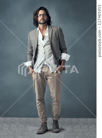 Businessman, portrait and serious in studio for fashion or corporate career with executive look for manager roll or supervisor. Man, trendy and stylish on grey background, glasses and confident. Businessman, portrait and serious in studio for fashion or corporate career with executive look for manager roll or supervisor. Man, trendy and stylish on grey background, glasses and confident. 117465955