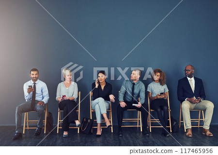 Business people, recruitment and waiting in line with technology for hiring process and employment opportunity. Diverse group, job seeker and phone in row for HR meeting with mockup space and banner Business people, recruitment and waiting in line with technology for hiring process and employment opportunity. Diverse group, job seeker and phone in row for HR meeting with mockup space and banner 117465956