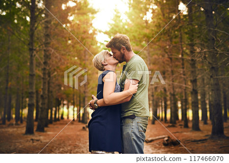 Couple, forest and happy with kiss for love with support, care and trust in Germany. People, relationship and affection in woods on holiday or vacation and travel for bonding, embrace and memories Couple, forest and happy with kiss for love with support, care and trust in Germany. People, relationship and affection in woods on holiday or vacation and travel for bonding, embrace and memories 117466070