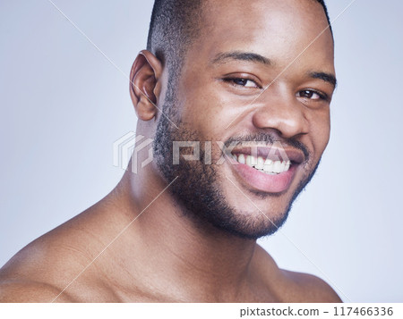 Black man, happy and skincare in studio portrait, facial treatment and cosmetics on blue background. Male person, healthy and pamper for dermatology, grooming and confident for smooth or clean skin Black man, happy and skincare in studio portrait, facial treatment and cosmetics on blue background. Male person, healthy and pamper for dermatology, grooming and confident for smooth or clean skin 117466336