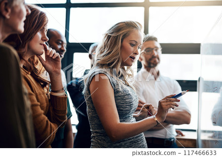 Presentation, writing and meeting with business woman and whiteboard for teamwork, training or project management. Idea, strategy and discussion for startup employees in office for brainstorming 117466633