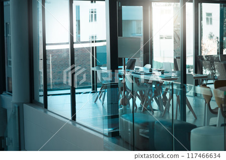 Empty room, table and chair for modern conference, corporate and meeting boardroom in building. Vacant, furniture and seats for luxury office or workplace, interior and minimalist design with glass Empty room, table and chair for modern conference, corporate and meeting boardroom in building. Vacant, furniture and seats for luxury office or workplace, interior and minimalist design with glass 117466634