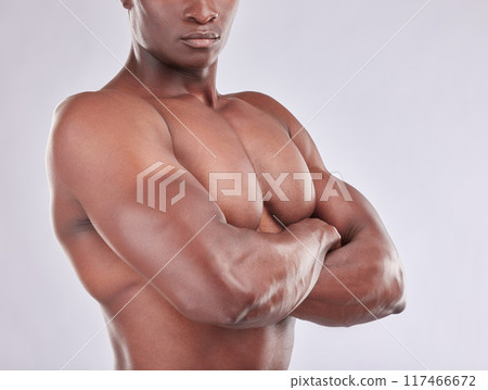 Black man, arms crossed and shirtless fitness in studio, strong biceps and muscle on white background. Male person, confidence and athlete for power or body, bodybuilder and topless for wellness 117466672