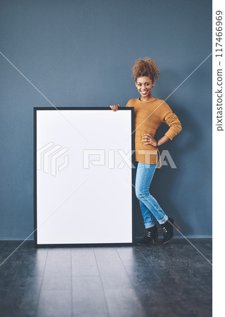 Happy, banner and portrait of woman on wall background for news, announcement and review. Mockup space, social media and person with sign, billboard or poster for information or advertising in studio 117466969