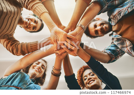 Portrait, support and hands of business people in stack for collaboration and team building in modern office. Community huddle, low angle and staff synergy for cooperation with partnership and smile Portrait, support and hands of business people in stack for collaboration and team building in modern office. Community huddle, low angle and staff synergy for cooperation with partnership and smile 117466974