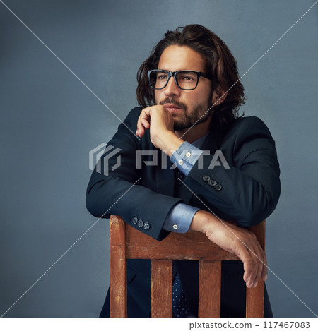 Chair, fashion and thinking with business man in studio on gray wall background for professional career. Corporate, future and idea with confident employee in suit for elegance, planning or power 117467083