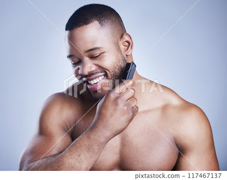 Black man, beard comb and grooming in studio, confident and haircare on blue background. Male person, brushing and maintenance for hygiene routine or cleaning, beauty and hair treatment for cosmetics Black man, beard comb and grooming in studio, confident and haircare on blue background. Male person, brushing and maintenance for hygiene routine or cleaning, beauty and hair treatment for cosmetics 117467137