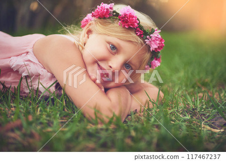 Girl, child and relax with portrait on grass for fresh air in outdoor, playing and happiness with flower crown. Female kid, laying and field for carefree, enjoyment and summer childhood or fun youth. Girl, child and relax with portrait on grass for fresh air in outdoor, playing and happiness with flower crown. Female kid, laying and field for carefree, enjoyment and summer childhood or fun youth. 117467237
