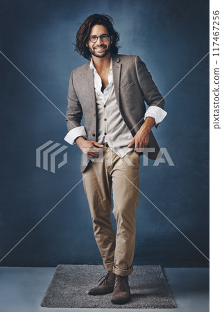 Businessman, portrait and happy on dark background for fashion or corporate career with executive look for manager roll or supervisor. Man, trendy and stylish in studio, glasses and confident. 117467256