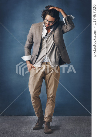 Business, man and thoughts with smile on dark background for fashion or corporate career with executive look. Person, trendy and stylish for manager role or supervisor in studio, thinking and glasses 117467320
