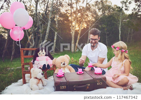 Girl, kid and tea party with father outdoor for playing, memory and childhood fun or entertainment. Dad, daughter and toys in garden for nature picnic with happiness, bonding and imagine with love. Girl, kid and tea party with father outdoor for playing, memory and childhood fun or entertainment. Dad, daughter and toys in garden for nature picnic with happiness, bonding and imagine with love. 117467342