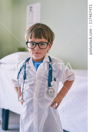 Boy, child and smile for doctor portrait for young physician, confident and future career in medicine or healthcare. Kid, glasses and educational roll play for growth or development and medical. 117467451