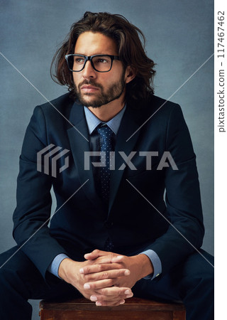 Fashion, suit and thinking with business man in studio on gray wall background for professional career. Corporate, future and planning with confident employee or in pride for elegance, power or style Fashion, suit and thinking with business man in studio on gray wall background for professional career. Corporate, future and planning with confident employee or in pride for elegance, power or style 117467462
