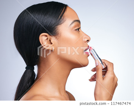 Cosmetics, lipstick and woman in profile for beauty, makeup and fashion product in grey studio background. Female person, relaxed and dermatology with red lips for confidence, makeover and glamour 117467474